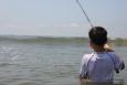 Young angler looking for his catch at Elmer's Island in Louisiana.
