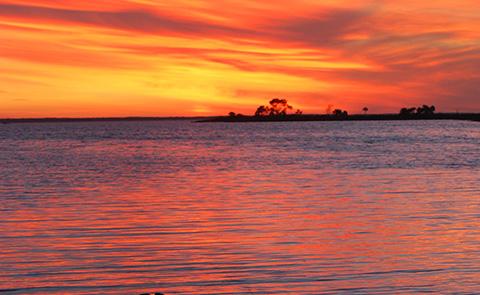 Sunset over the water in Apalachicola, FL