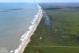 More than 14 miles of beaches and dunes were restored using sediments pumped from offshore borrow areas. (Photo: Patrick M. Quigley) an aerial of mcfadden beach's shoreline