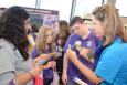 Children learn about wetlands while a science educator holds a juvenile alligator. Photo: Louisiana Sea Grant