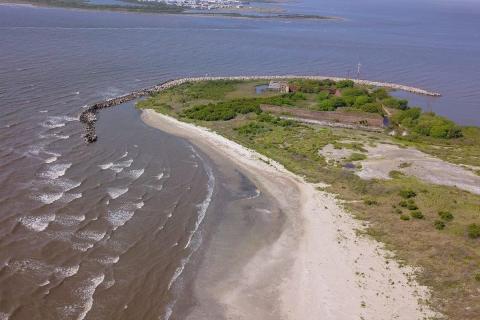 Aerial view of an island with shoreline protection. Credit Providence Engineering.