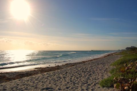 The sun sets over a Gulf Coast beach in Florida. 