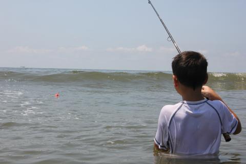 Young angler looking for his catch at Elmer's Island in Louisiana.