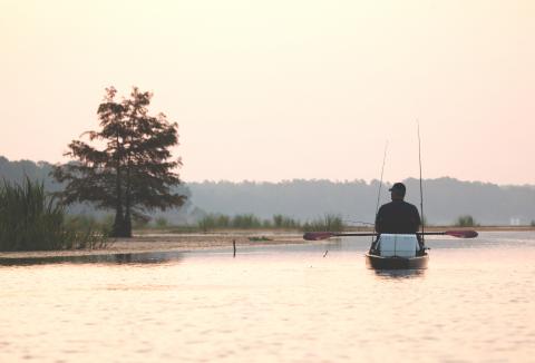 man kayaks on Louisiana coast