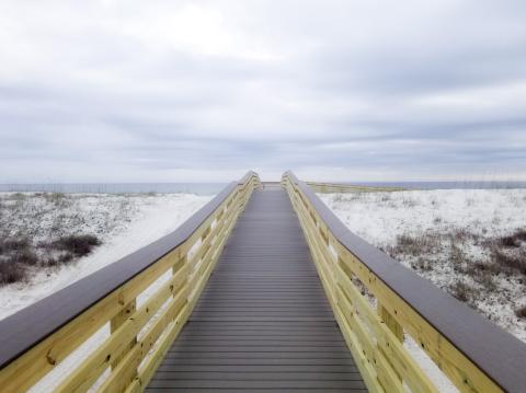 boardwalk in white sand 